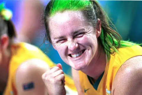 Close-up of Australian wheelchair basketball player Liesl Tesch grinning and clenching her fist after scoring at the 2000 Sydney Paralympic Games.